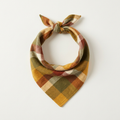 Harvest plaid flannel dog bandana in gold, olive and rust check, tied in a triangle knot on a plain background