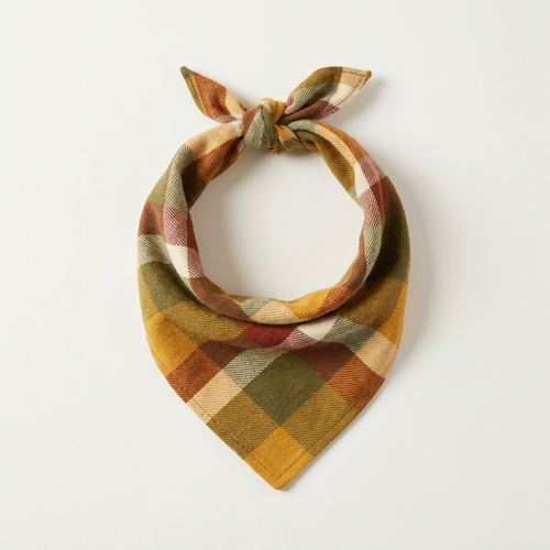 Harvest plaid flannel dog bandana in gold, olive and rust check, tied in a triangle knot on a plain background