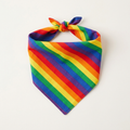 Rainbow striped dog bandana tied in a triangle knot on a plain background